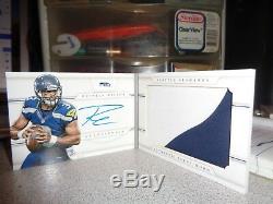 2013 nfl russell wilson national treasures booklet auto/jersey 12/25