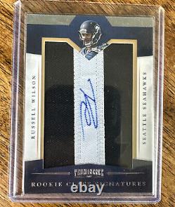 RUSSELL WILSON 2012 PROMINENCE ROOKIE PATCH AUTO #/150 RC Jersey Letter Relic